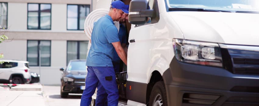 electrician getting equipment out of van