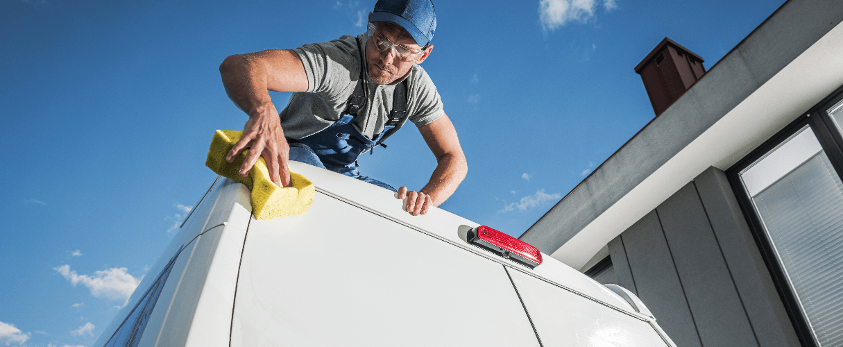 man cleaning his van